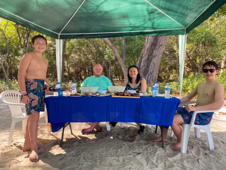 Guests snorkeling off the boat during a Papagayo beach day tour