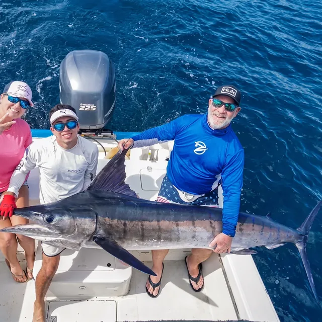 Anglers with a marlin catch aboard a Papagayo fishing charter