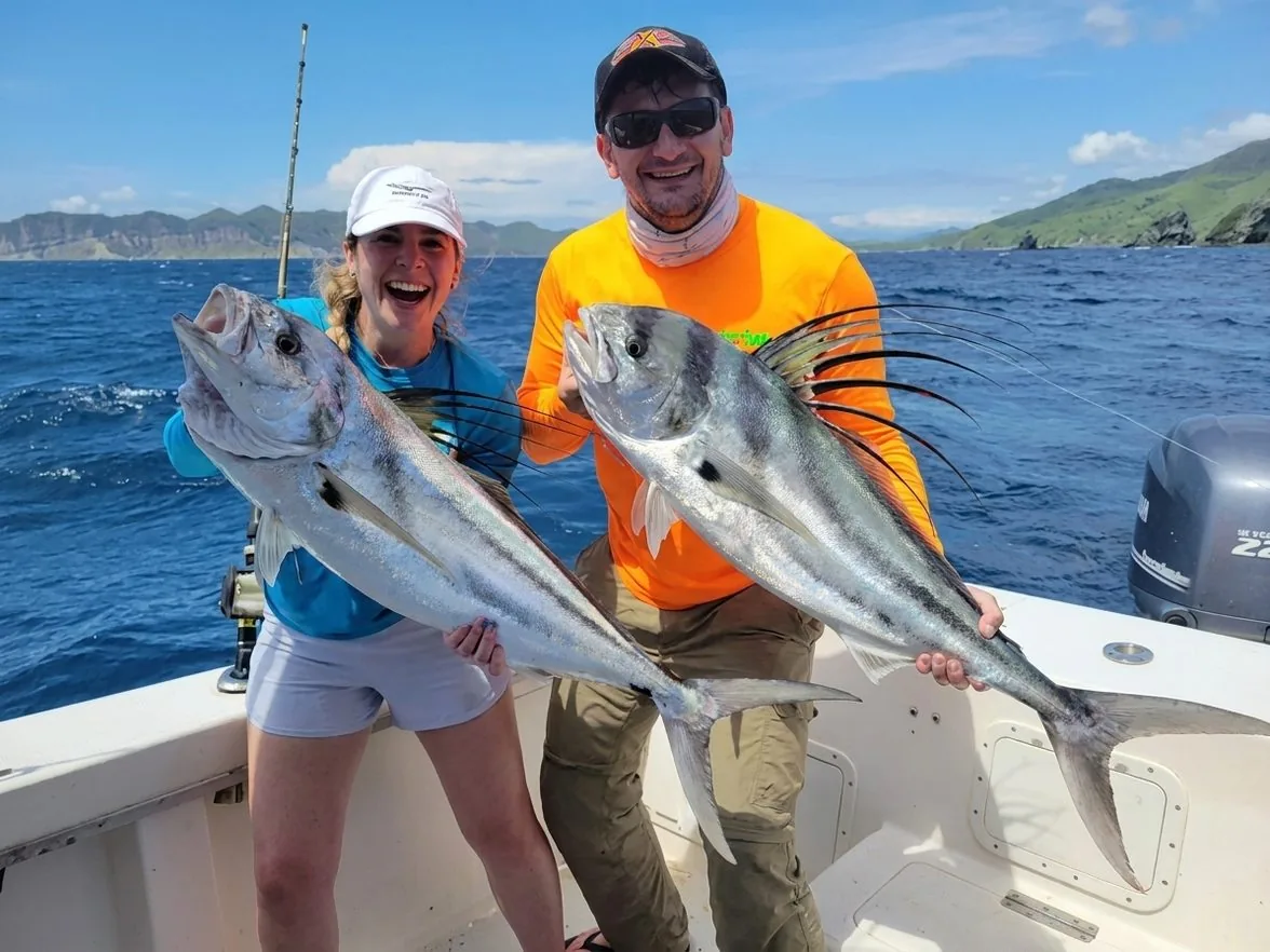 Two roosterfish caught inshore near Papagayo's rocky coastline
